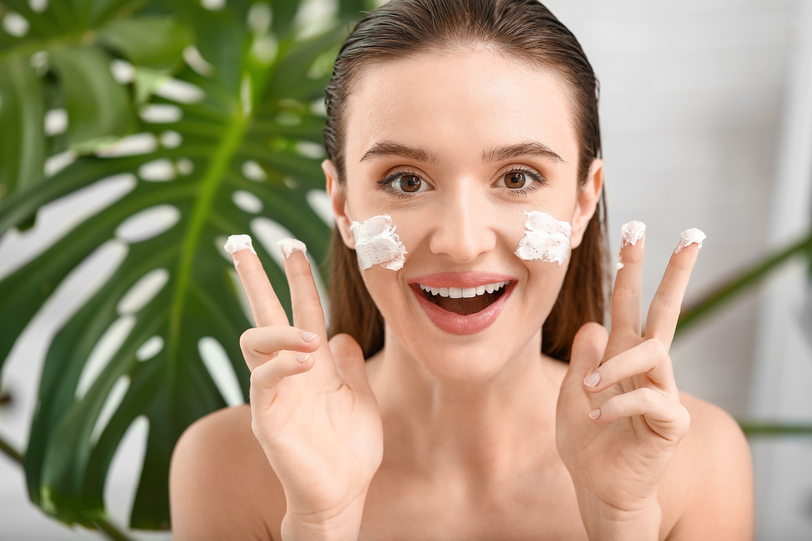 Woman Applying Facial Cream